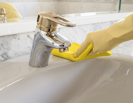 Bathroom sanitising during a move in cleaning service in E16